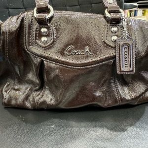 Authentic - almost new Coach patent leather handbag.